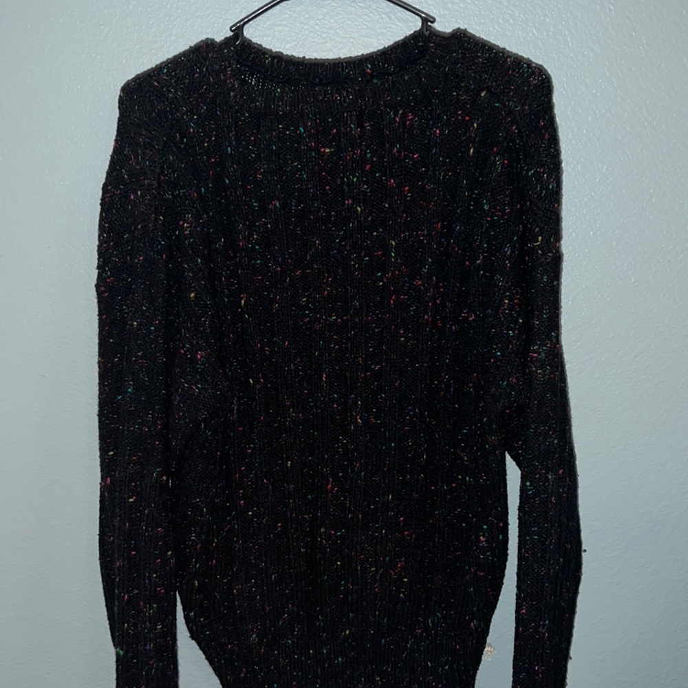 Speckled black sweater